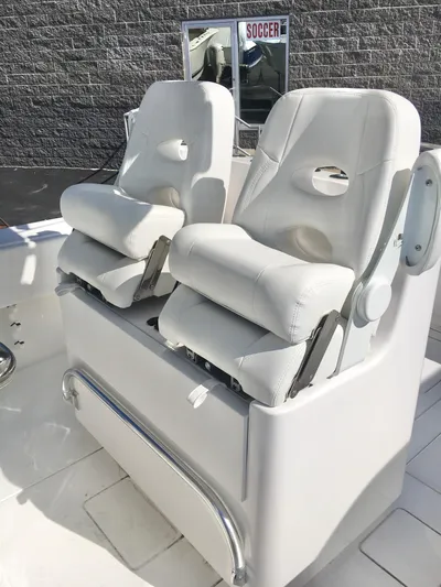 Yacht Photos Pics 2024 Contender 32 ST boat seats, white leather, modern design, outdoor setting.