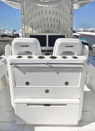 Yacht Photos Pics 2024 Contender 32 ST boat interior with dual seats and control panel.