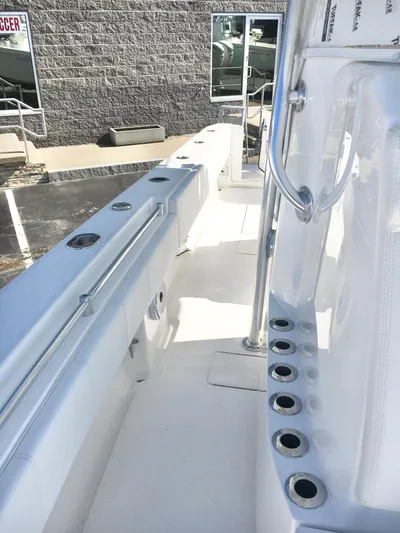  Yacht Photos Pics 2024 Contender 32 ST boat deck with rod holders and sleek design.