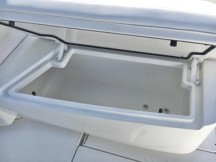  Yacht Photos Pics 2024 Contender 32 ST boat storage compartment, open and empty, showcasing interior space.
