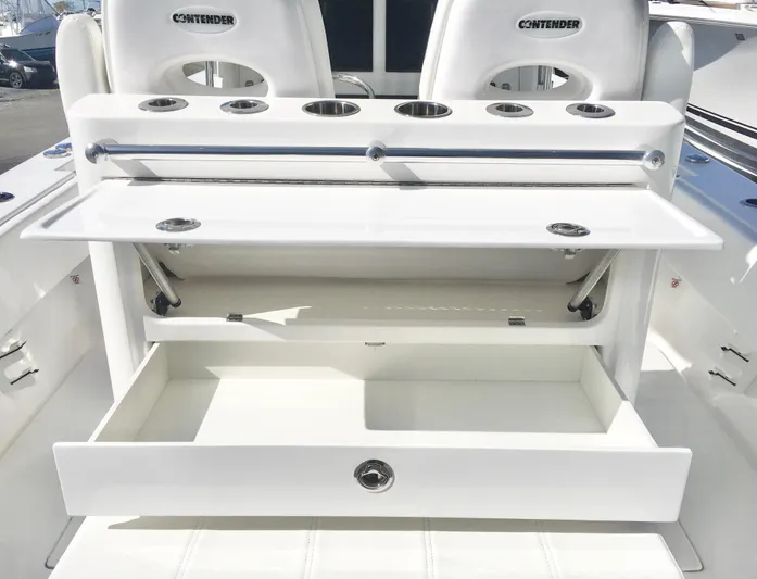  Yacht Photos Pics 2024 Contender 32 ST boat with open storage compartments and rod holders.