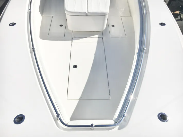  Yacht Photos Pics 2024 Contender 32 ST boat deck with sleek white finish and seating area.