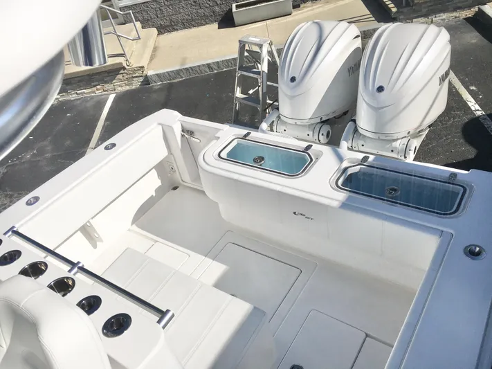  Yacht Photos Pics 2024 Contender 32 ST boat with dual outboard engines and spacious deck layout.
