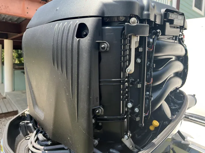  Yacht Photos Pics Close-up of 2015 Robalo R305 Walkaround boat engine.