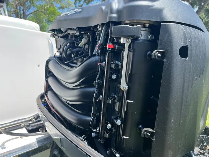  Yacht Photos Pics Close-up of the engine of a 2015 Robalo R305 Walkaround boat.