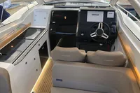 Interior of 2023 Nimbus W9 boat with modern steering and navigation system.