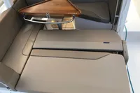 2023 Nimbus W9 interior with sleek seating and wooden table design.