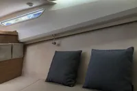 Interior of 2023 Nimbus W9 boat with cozy seating and cushions.