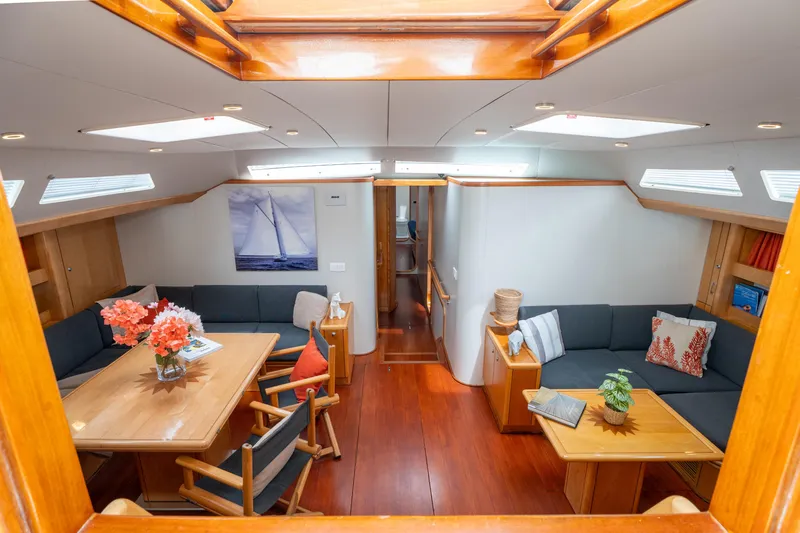 Django Too Yacht Photos Pics Luxurious interior of 1991 Trehard SLOOP 83 yacht with elegant seating and decor.