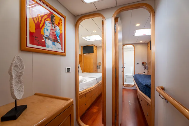 Django Too Yacht Photos Pics Luxurious interior of 1991 Trehard SLOOP 83 yacht with modern decor and cozy cabins.