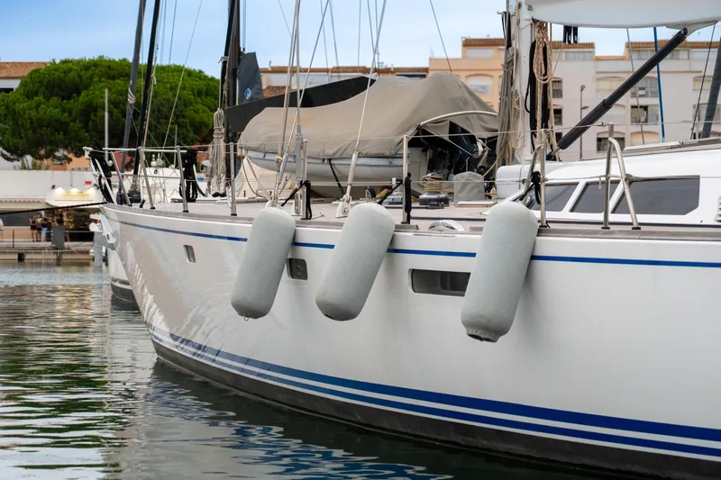 Django Too Yacht Photos Pics Sloop 83 yacht by Trehard, 1991 model, docked with fenders, calm marina setting.