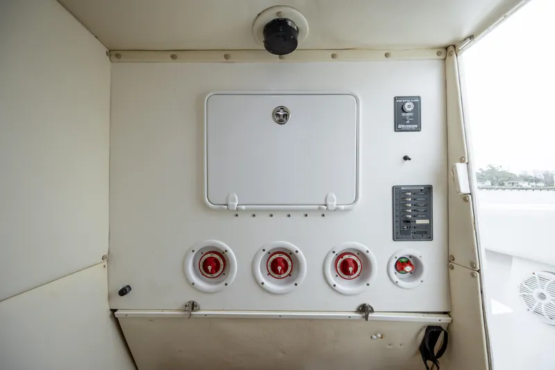 Hoo Hunter Yacht Photos Pics Control panel of a 2012 SeaHunter 37 Tournament boat, featuring switches and gauges.