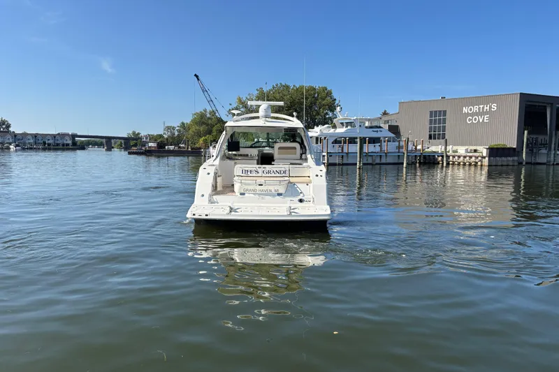 Life's Grande Yacht Photos Pics 2012 Sea Ray 470 Sundancer yacht on calm water near North's Cove marina.