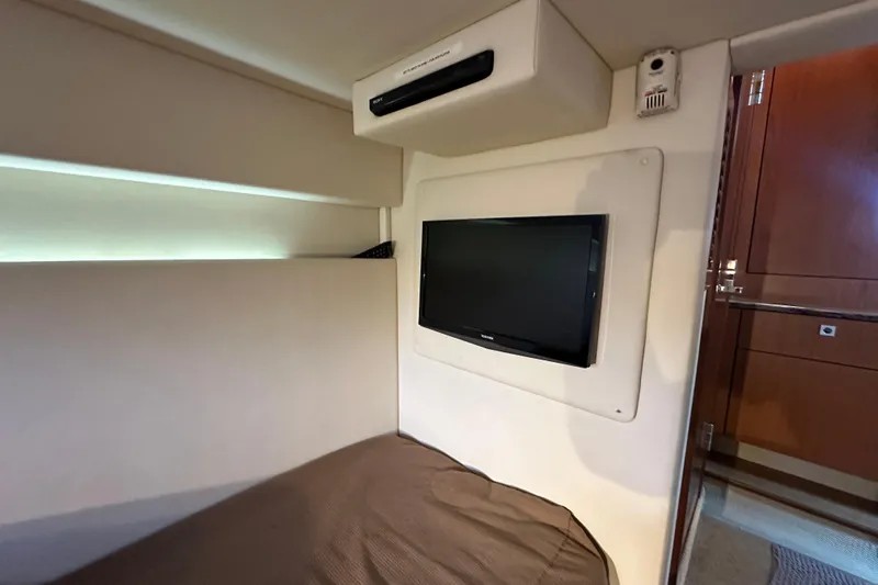 Life's Grande Yacht Photos Pics Interior cabin of 2012 Sea Ray 470 Sundancer with wall-mounted TV.