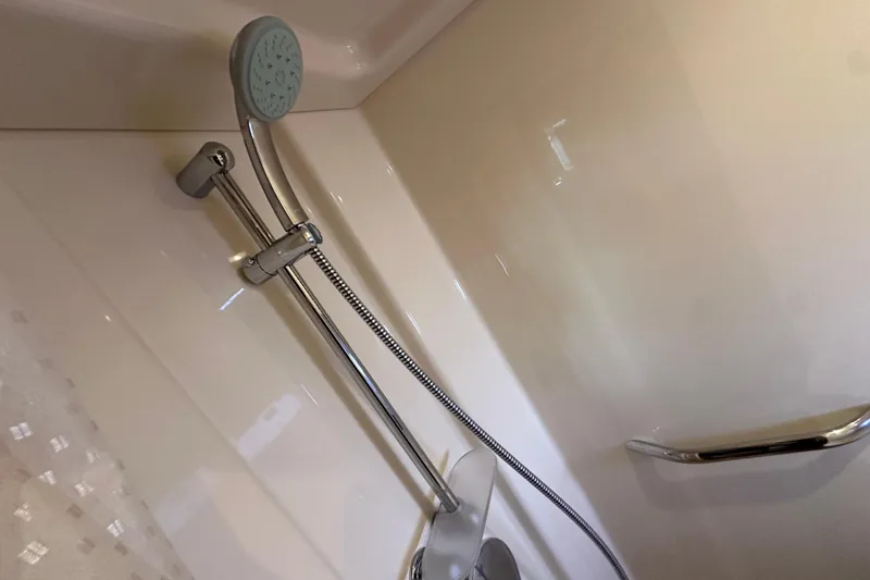 Life's Grande Yacht Photos Pics Shower area in 2012 Sea Ray 470 Sundancer yacht, featuring modern fixtures and handheld showerhead.