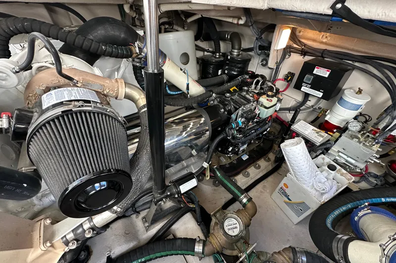 Life's Grande Yacht Photos Pics Engine room of 2012 Sea Ray 470 Sundancer, showcasing mechanical components and systems.