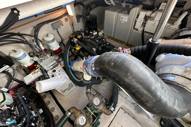 Life's Grande Yacht Photos Pics Engine room of 2012 Sea Ray 470 Sundancer, showcasing mechanical components and wiring.