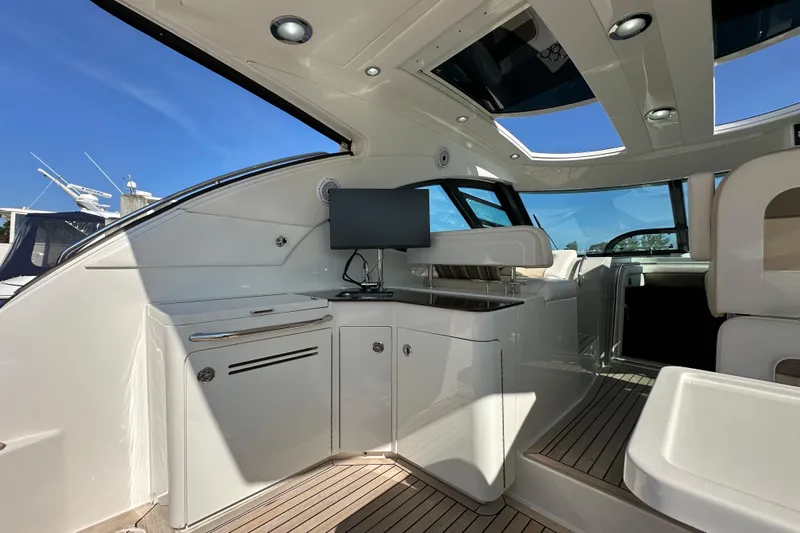 Life's Grande Yacht Photos Pics Luxurious interior of 2012 Sea Ray 470 Sundancer yacht with modern amenities and sleek design.