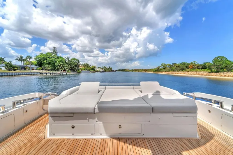 Evexias Yacht Photos Pics Luxurious Azimut S7 FLY 2020 yacht deck with sun loungers, scenic waterway view.