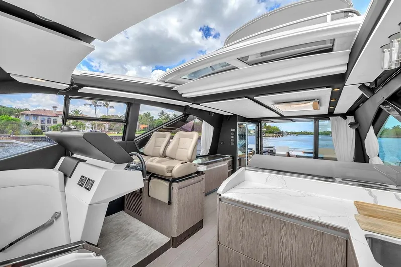 Evexias Yacht Photos Pics Luxurious interior of 2020 Azimut S7 FLY yacht with modern design and scenic water views.