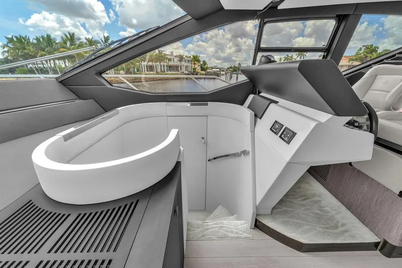 Evexias Yacht Photos Pics Luxurious interior of 2020 Azimut S7 FLY yacht with modern helm and panoramic windows.