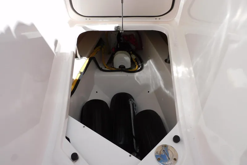 Tempus Yacht Photos Pics Storage compartment of 2016 Pursuit DC 325 Dual Console boat, featuring equipment and gear.