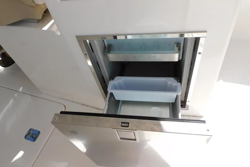 Tempus Yacht Photos Pics Open storage compartment on 2016 Pursuit DC 325 Dual Console boat.