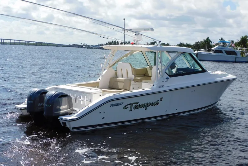 Tempus Yacht Photos Pics 2016 Pursuit DC 325 Dual Console boat on water with Yamaha engines.