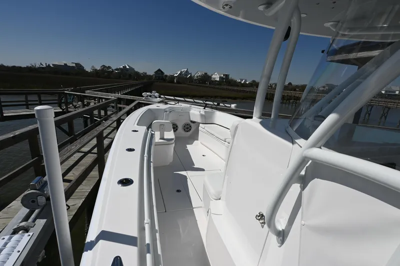  Yacht Photos Pics 2023 Contender 32ST boat docked, showcasing sleek design and spacious deck.