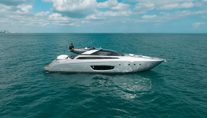 Purosangue Yacht Photos Pics Luxury 2014 Riva 86' DOMINO yacht cruising on open sea under blue sky.