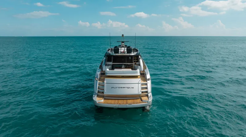 Purosangue Yacht Photos Pics Luxury Riva 86' DOMINO yacht on open sea, 2014 model, clear sky.