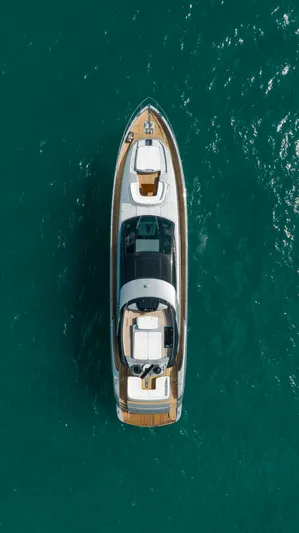 Purosangue Yacht Photos Pics Aerial view of 2014 Riva 86' DOMINO yacht on turquoise water.