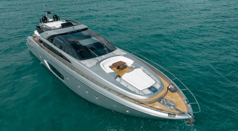 Purosangue Yacht Photos Pics Luxurious 2014 Riva 86' DOMINO yacht cruising on clear blue waters.