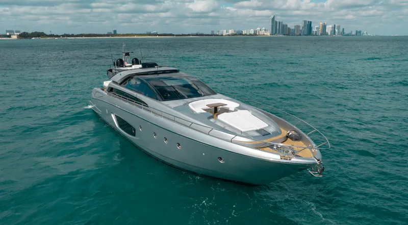 Purosangue Yacht Photos Pics Luxury 2014 Riva 86' DOMINO yacht cruising near city skyline.