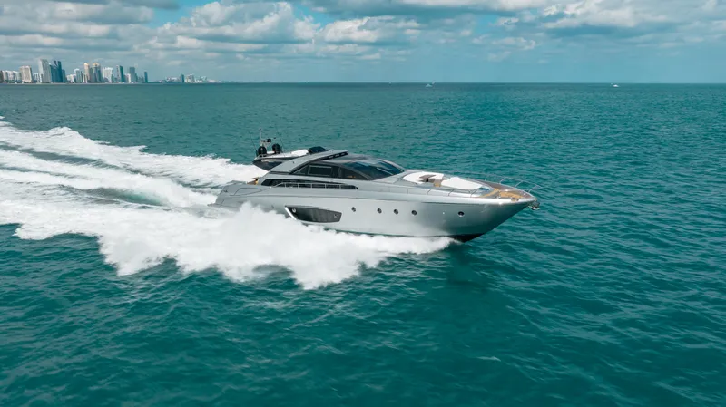 Purosangue Yacht Photos Pics Luxury 2014 Riva 86' DOMINO yacht cruising on open sea with city skyline.