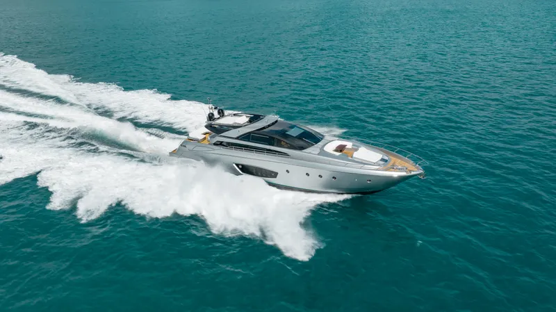 Purosangue Yacht Photos Pics Luxury 2014 Riva 86' DOMINO yacht cruising on turquoise waters.