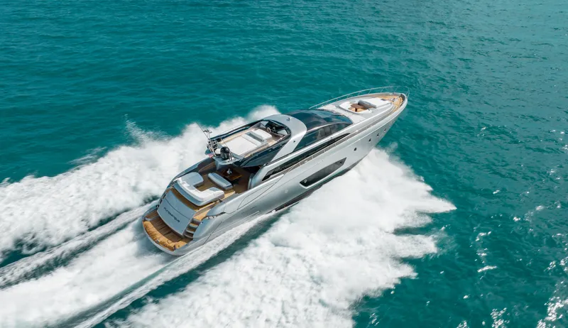 Purosangue Yacht Photos Pics Luxurious 2014 Riva 86' DOMINO yacht cruising on turquoise waters.