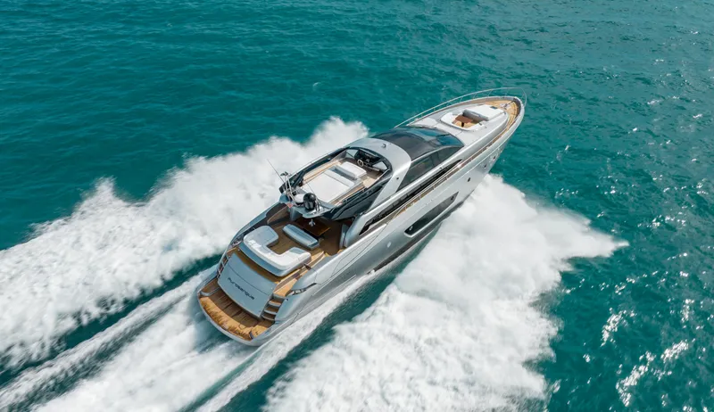 Purosangue Yacht Photos Pics Luxurious 2014 Riva 86' DOMINO yacht cruising on turquoise waters.