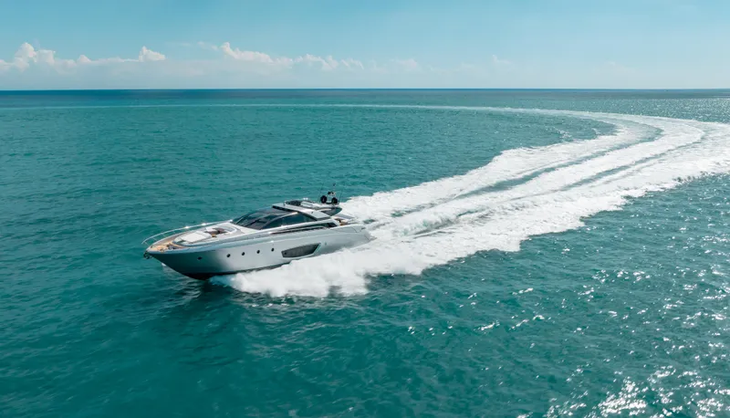 Purosangue Yacht Photos Pics Luxury yacht Riva 86' DOMINO 2014 cruising on open sea under clear skies.