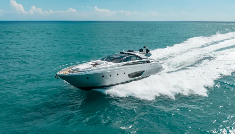 Purosangue Yacht Photos Pics Luxurious 2014 Riva 86' DOMINO yacht cruising on open sea under clear skies.