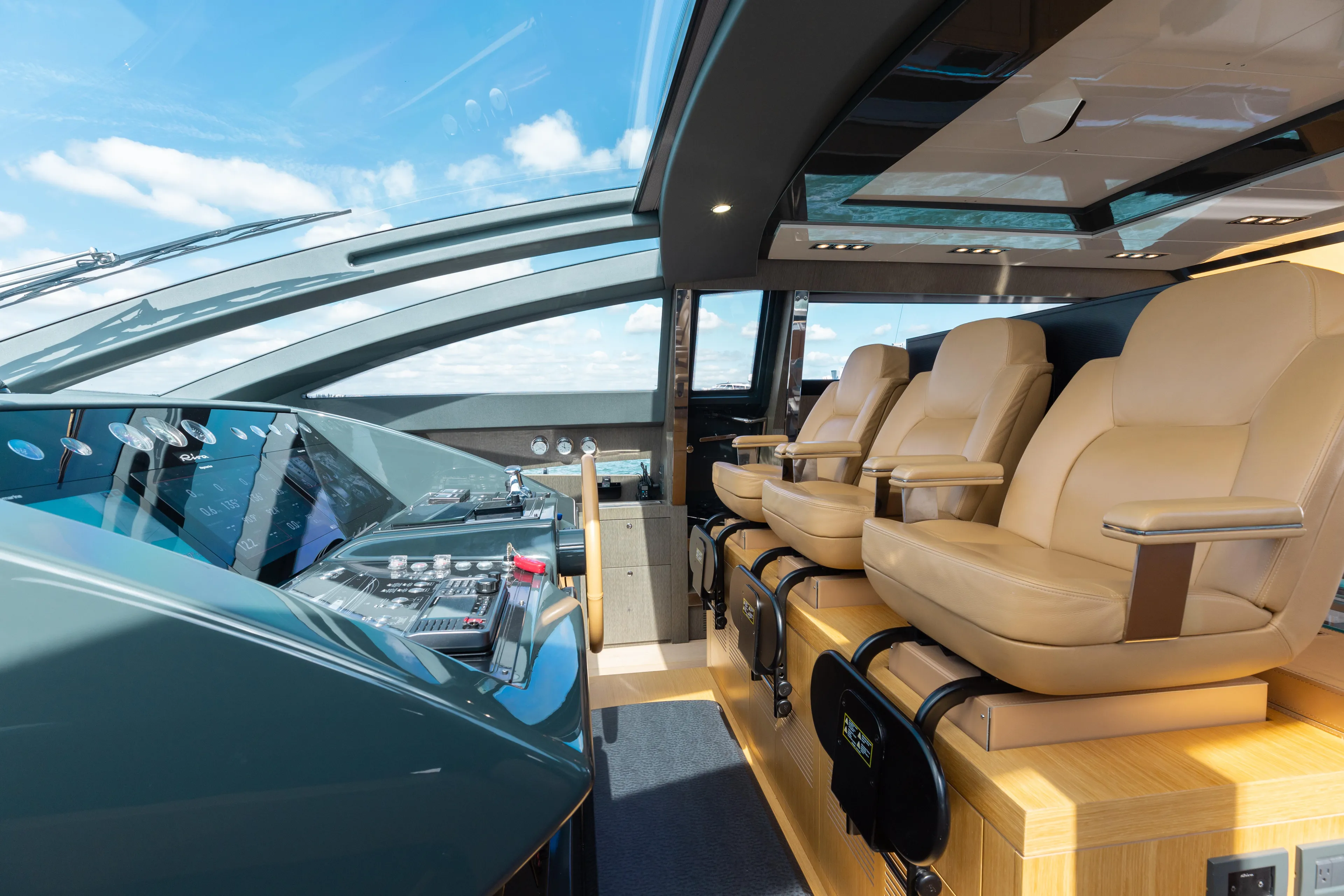 Purosangue Yacht Photos Pics Luxurious interior of 2014 Riva 86' DOMINO yacht with plush seating and modern controls.