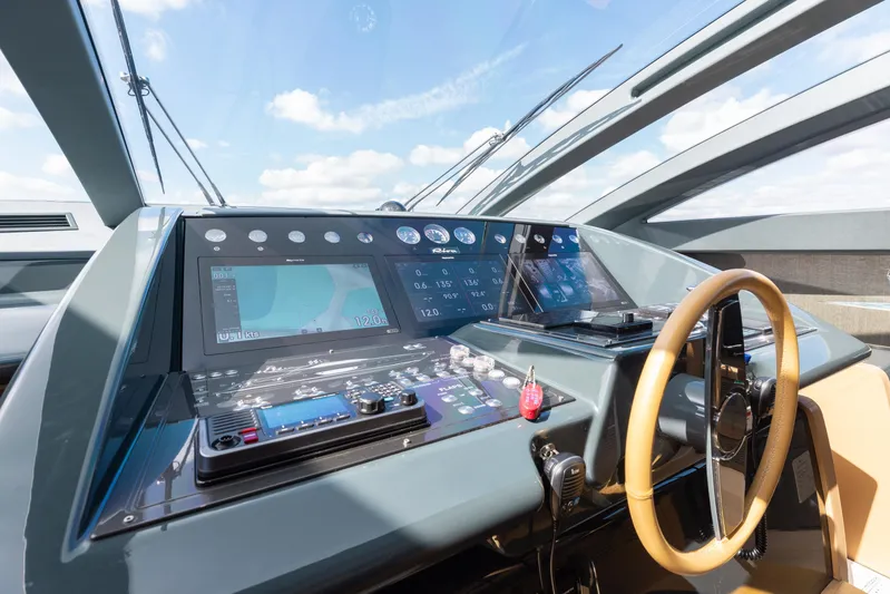 Purosangue Yacht Photos Pics Cockpit of 2014 Riva 86' DOMINO yacht with modern navigation equipment and steering wheel.