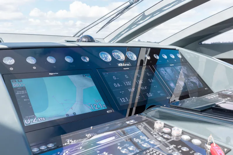 Purosangue Yacht Photos Pics Control panel of 2014 Riva 86' DOMINO yacht with navigation screens and gauges.