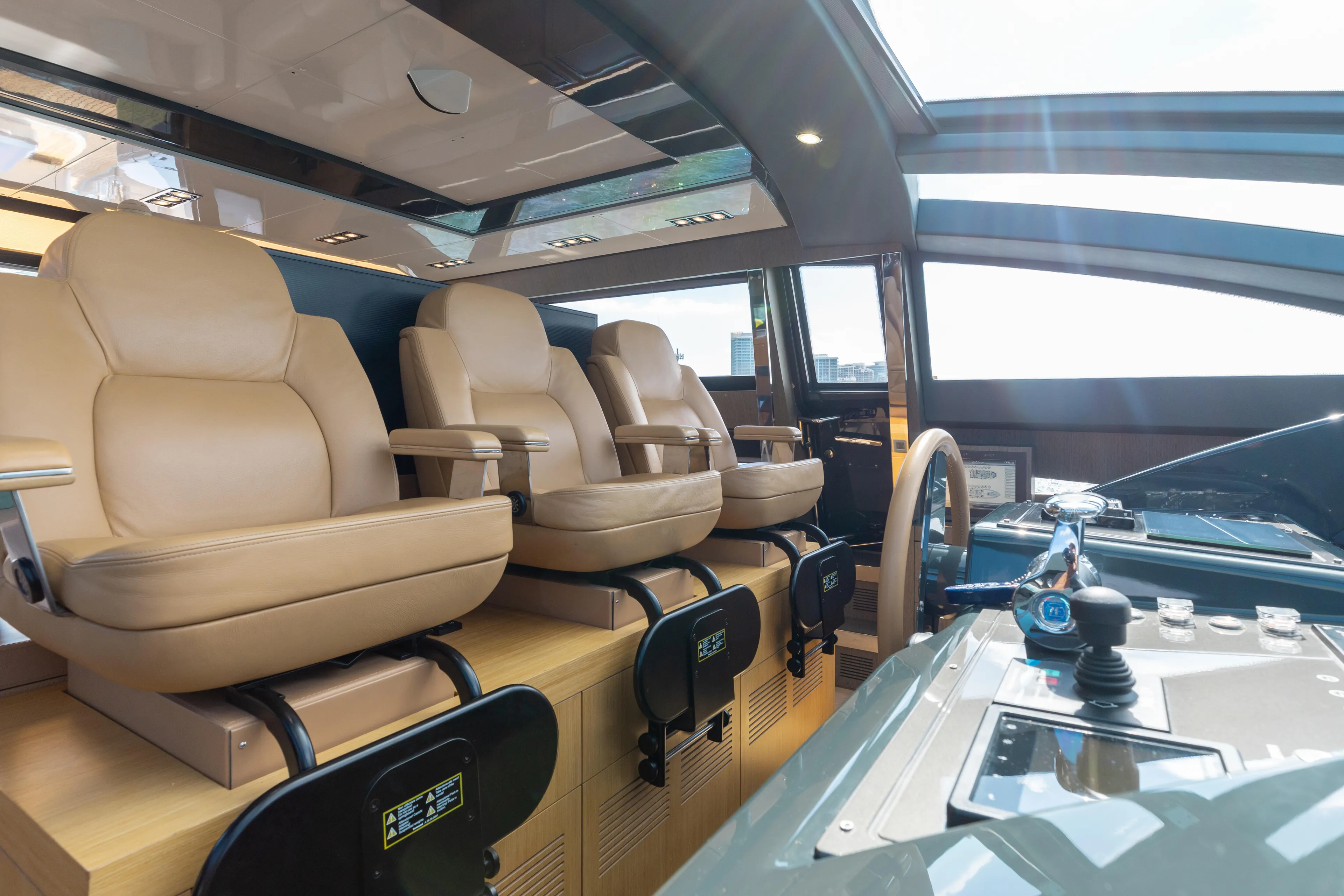 Purosangue Yacht Photos Pics Luxurious interior of 2014 Riva 86' DOMINO yacht with leather seating and modern controls.