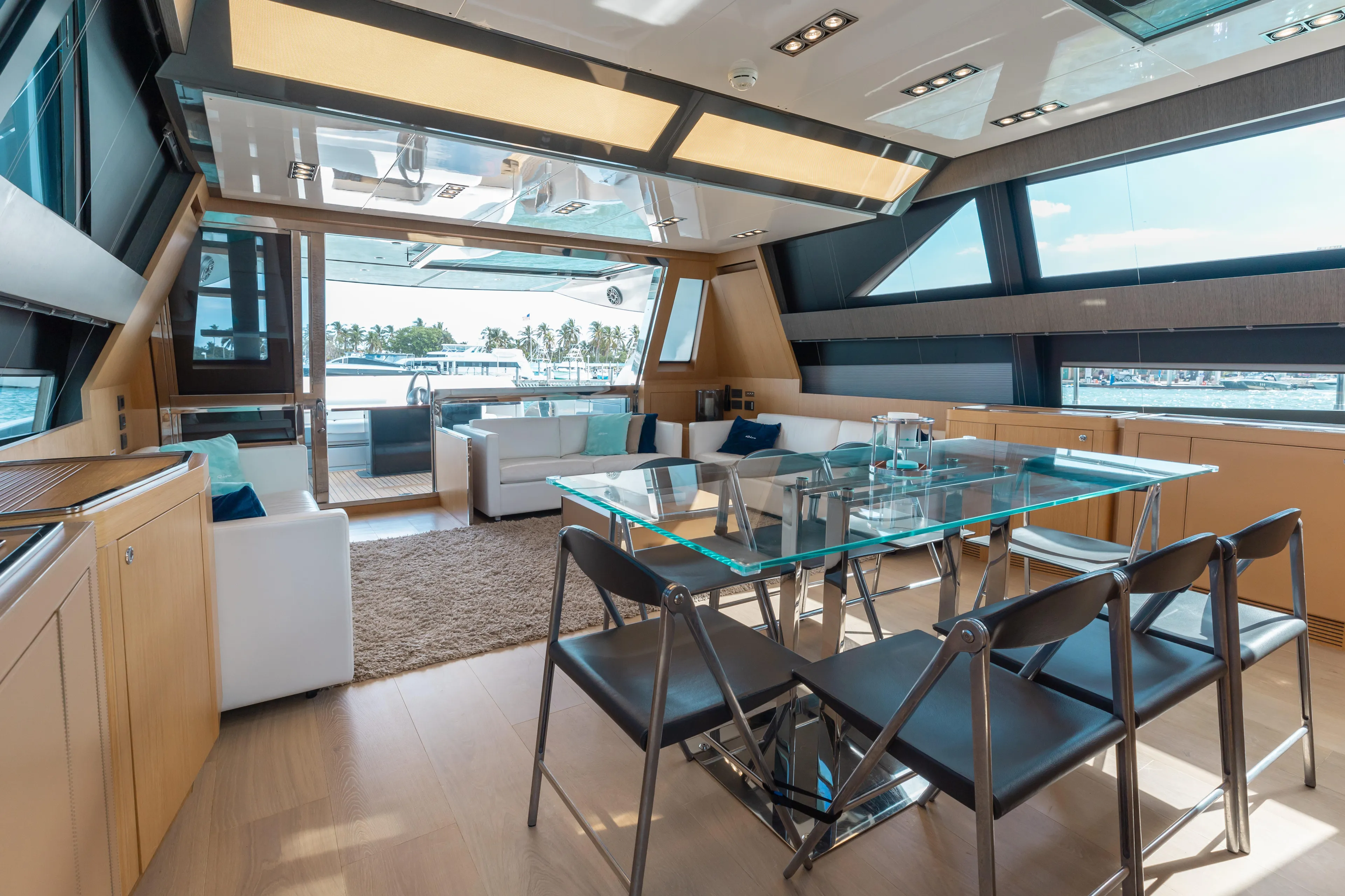 Purosangue Yacht Photos Pics Luxurious interior of 2014 Riva 86' DOMINO yacht with modern dining area and ocean view.