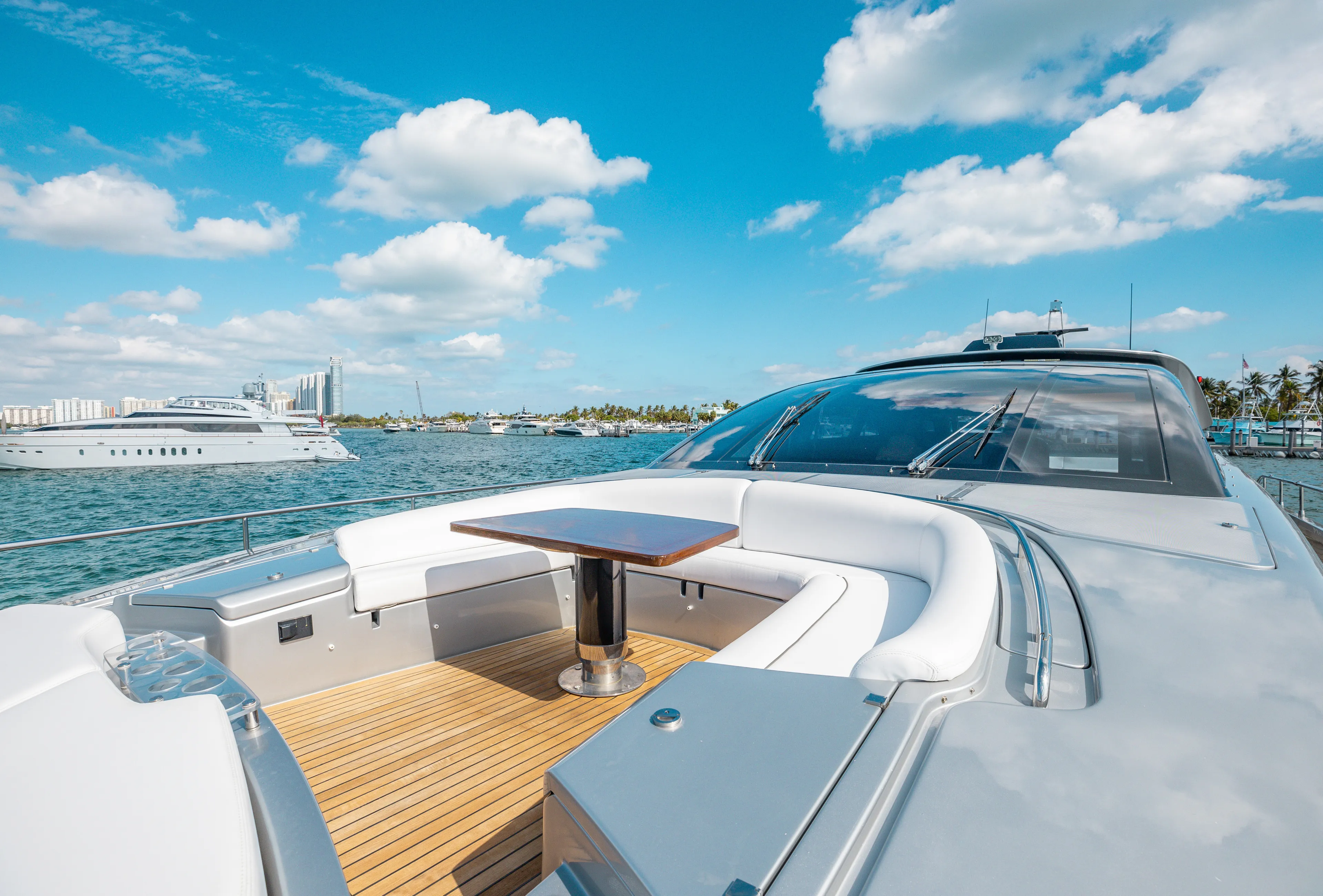 Purosangue Yacht Photos Pics Luxurious 2014 Riva 86' DOMINO yacht with sleek deck and seating area on a sunny day.