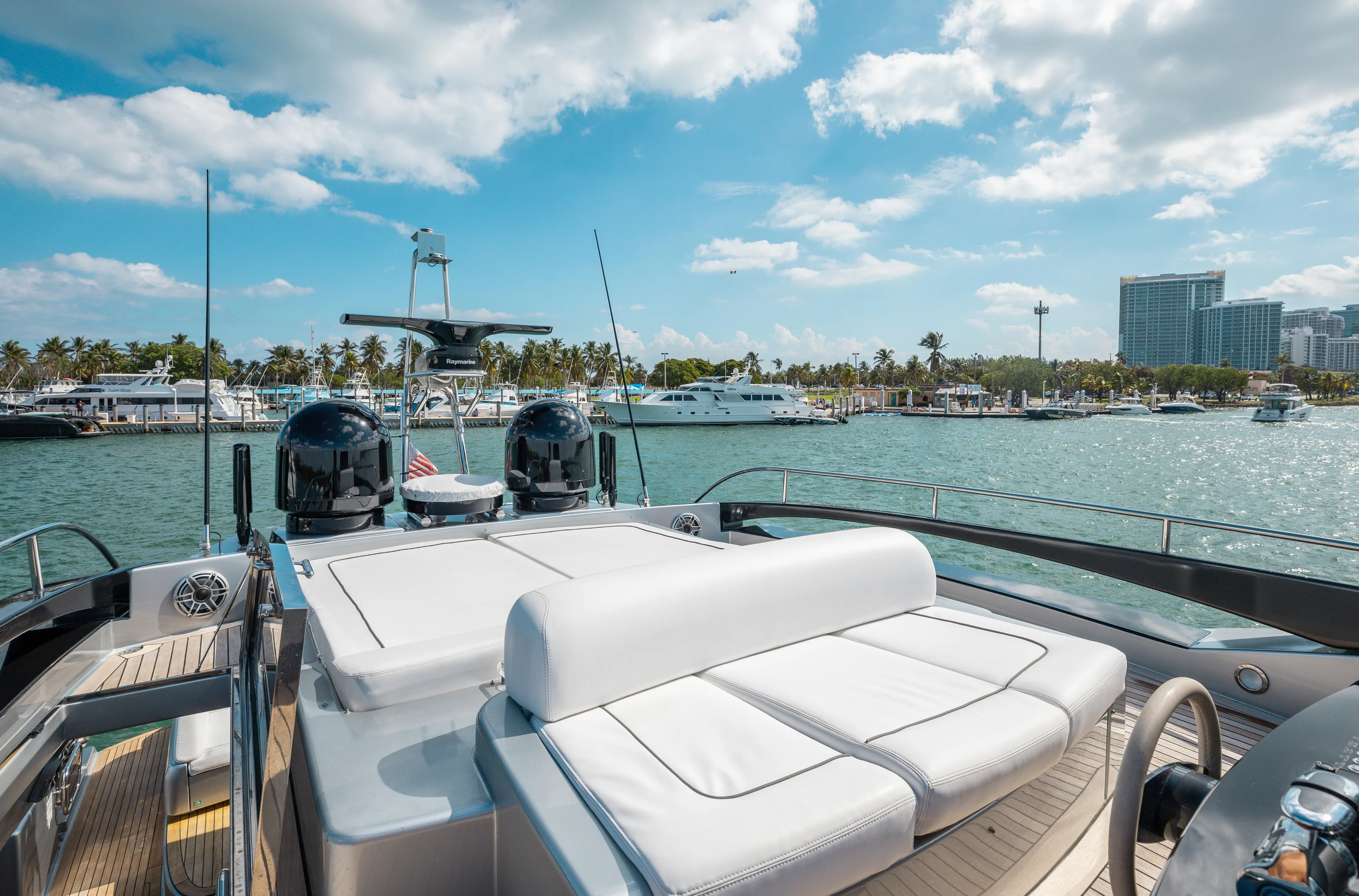 Purosangue Yacht Photos Pics Luxurious 2014 Riva 86' DOMINO yacht docked in a sunny marina.