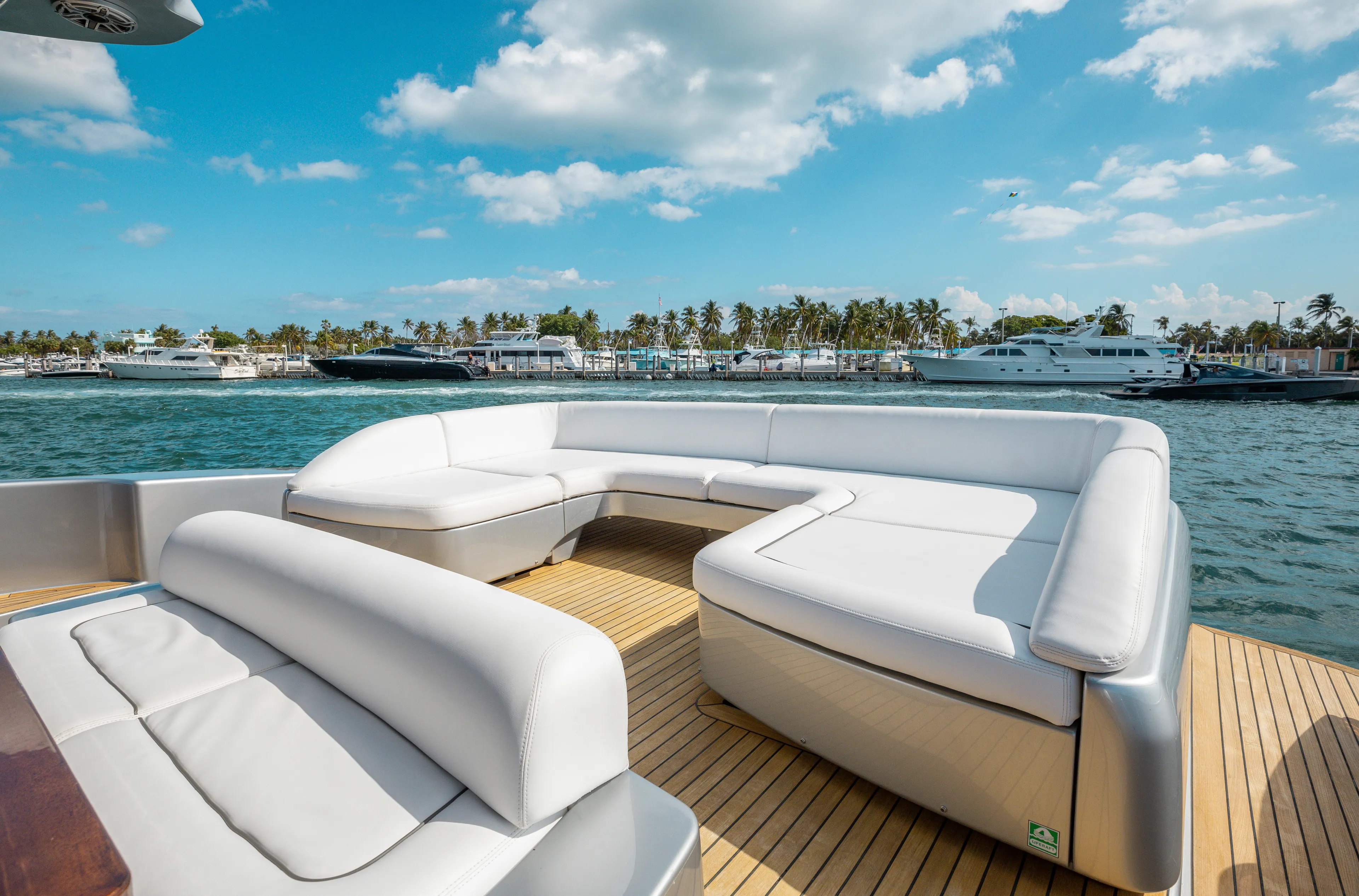 Purosangue Yacht Photos Pics Luxurious seating on 2014 Riva 86' DOMINO yacht with ocean view and blue sky.