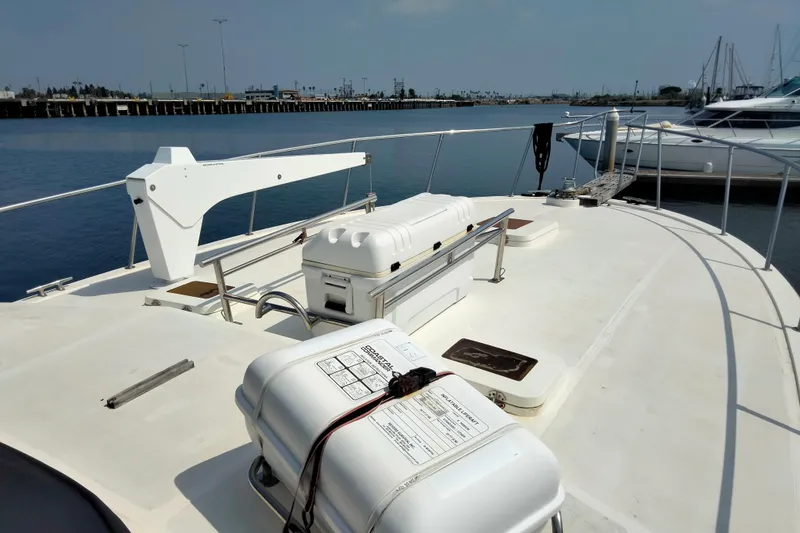 "travler" Yacht Photos Pics 1985 50' Pacifica Long Range Sportfisherman boat deck with equipment, docked in marina.