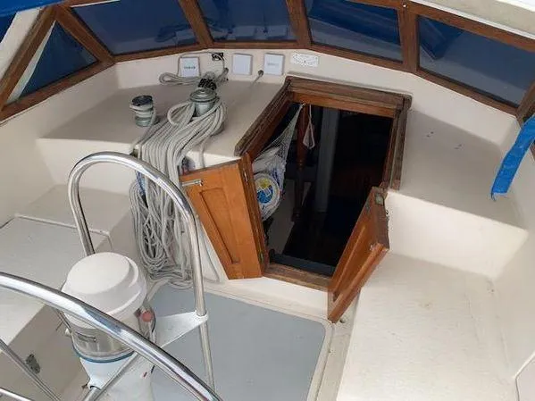 Interior of 1989 Custom SEA MAID boat with open hatch and coiled ropes.